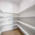 Huge walk-in pantry with shelving